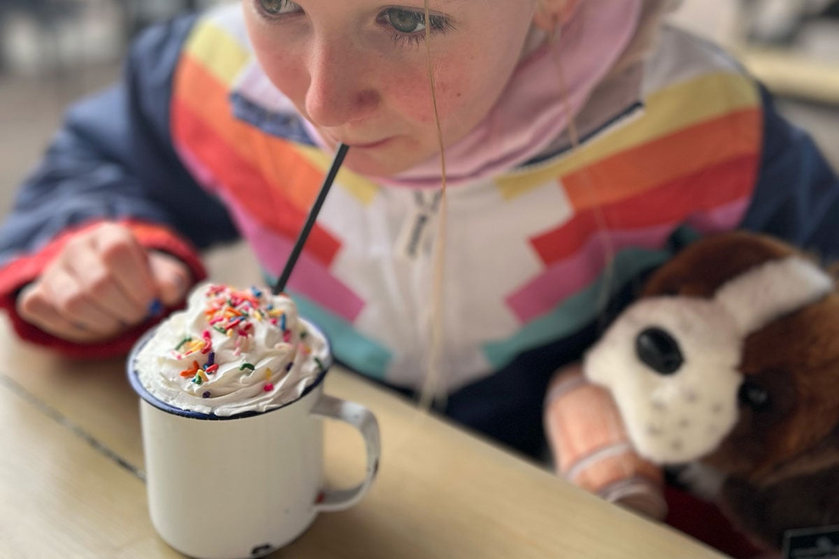 Happy Child with Drink - MercPerks