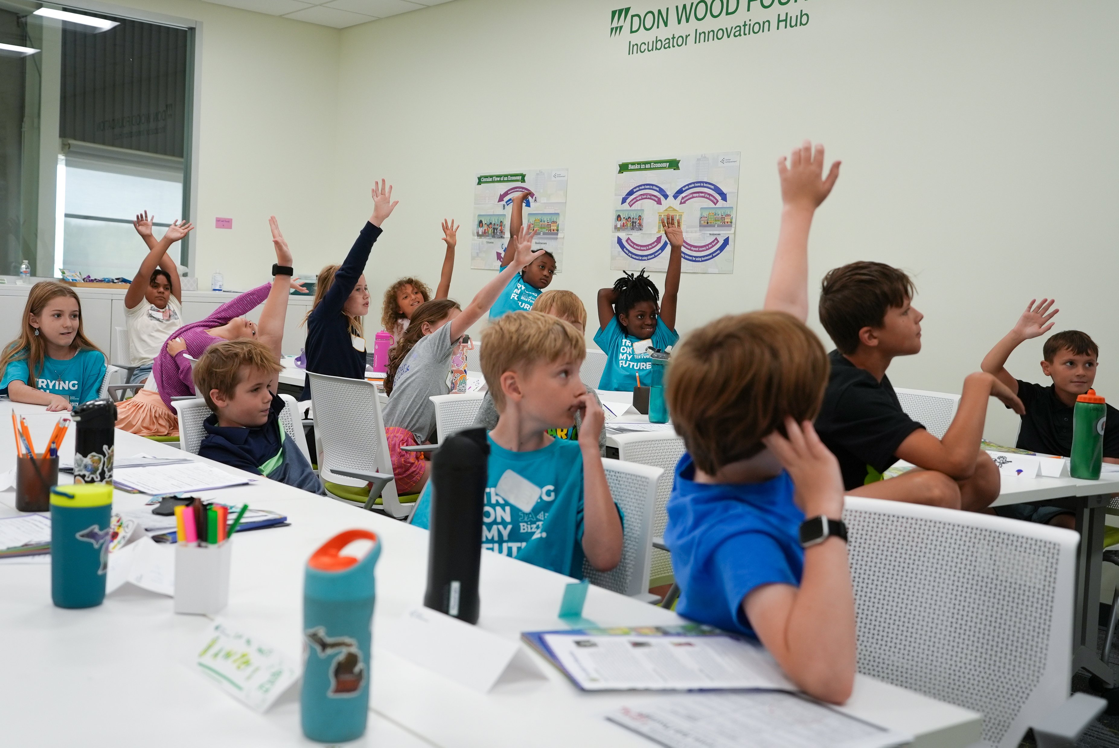 Junior Achievement - Kids Raising Their Hands