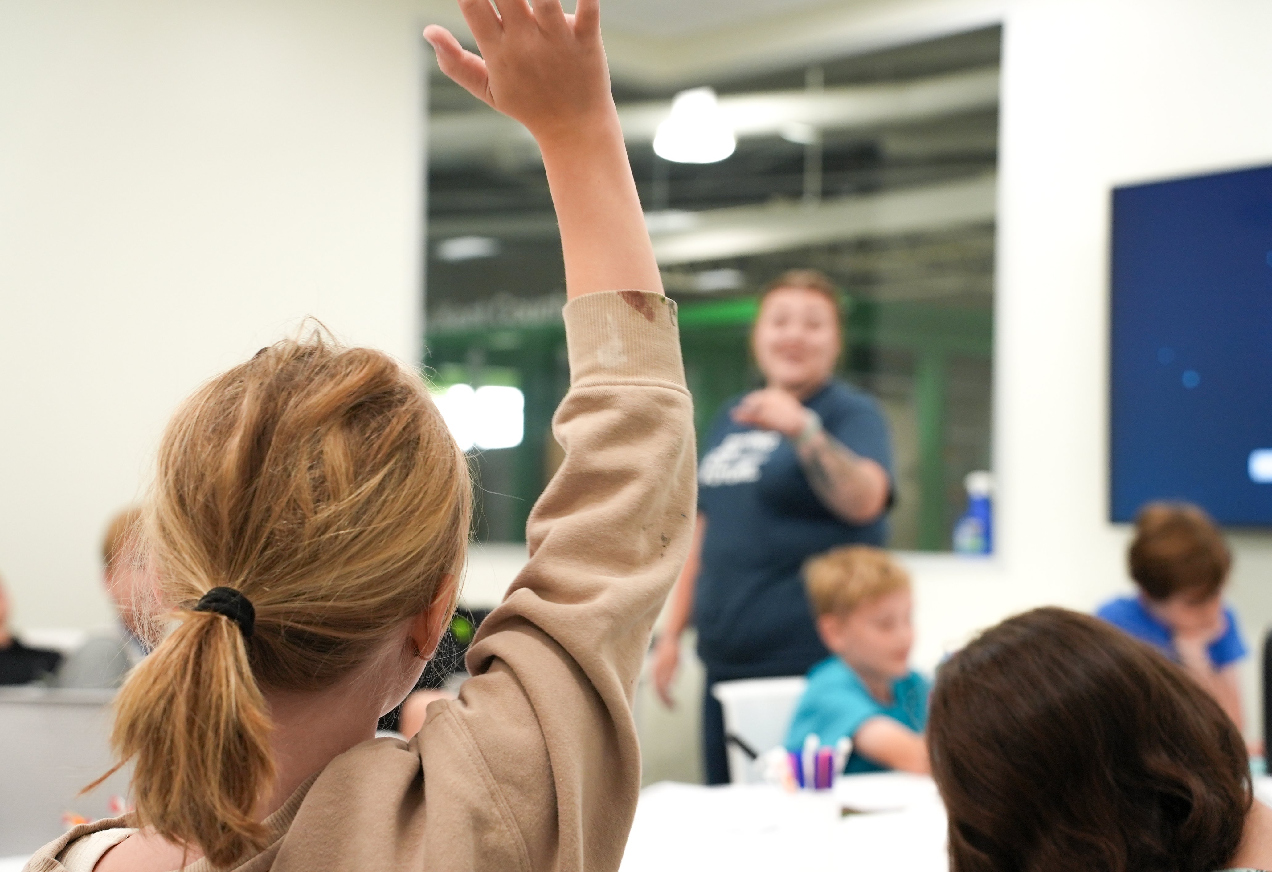 Girl Raising Her Hand In Class