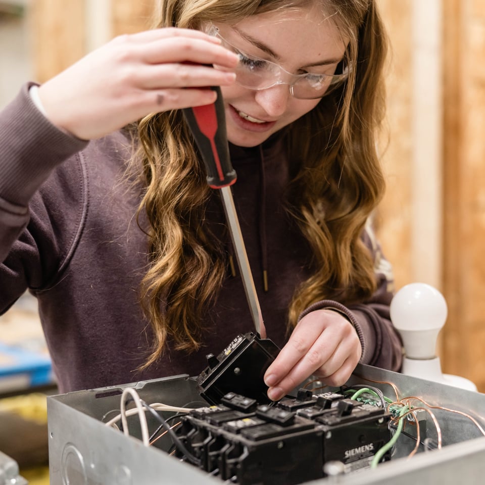 Women working on electronics