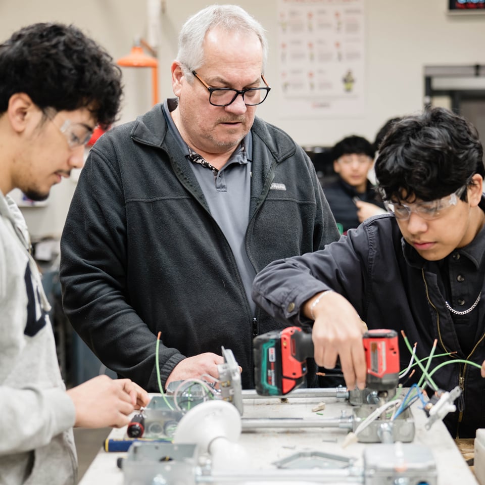Students working with instructor